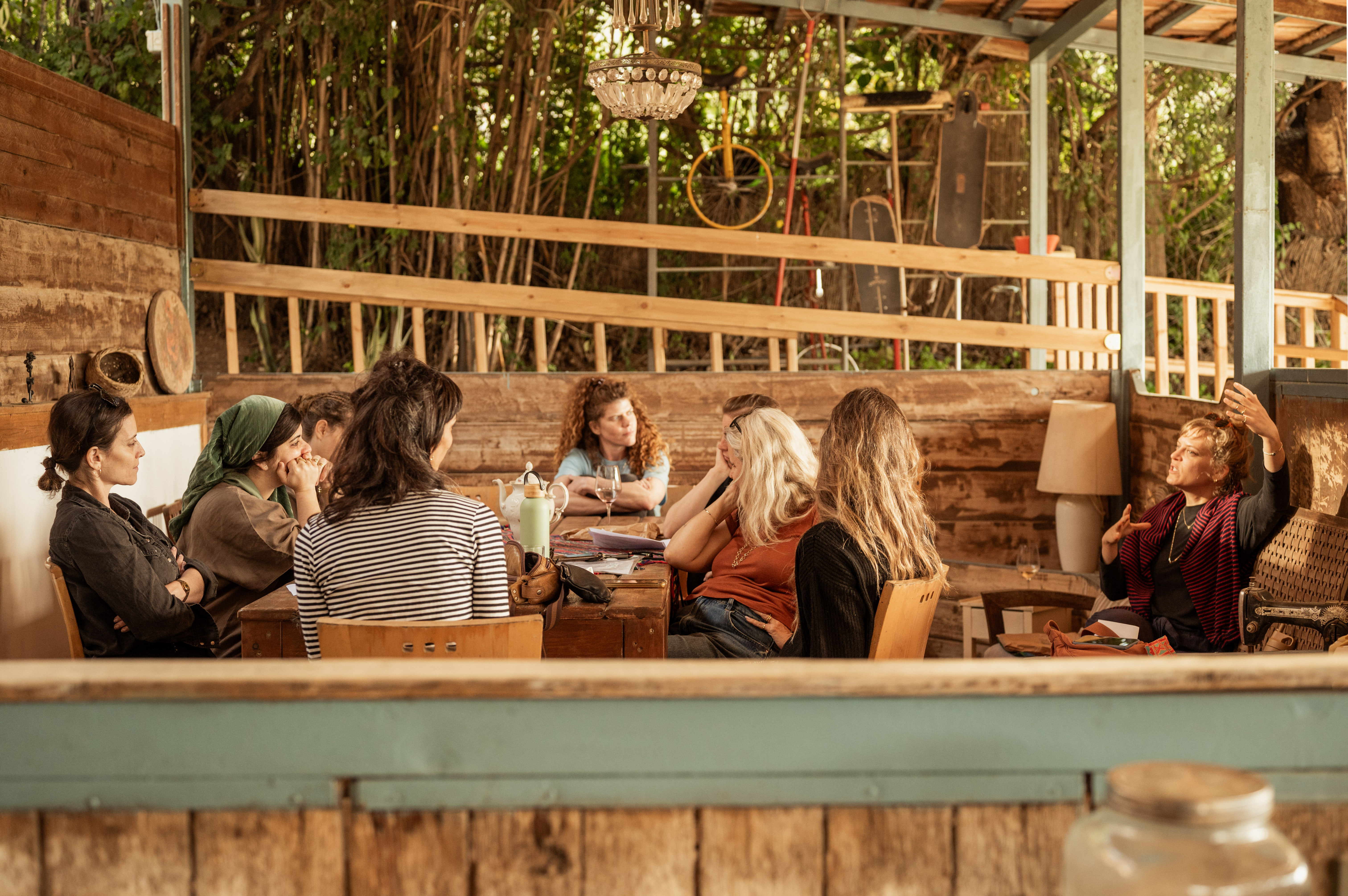 Study group of women gathered around a table learning together