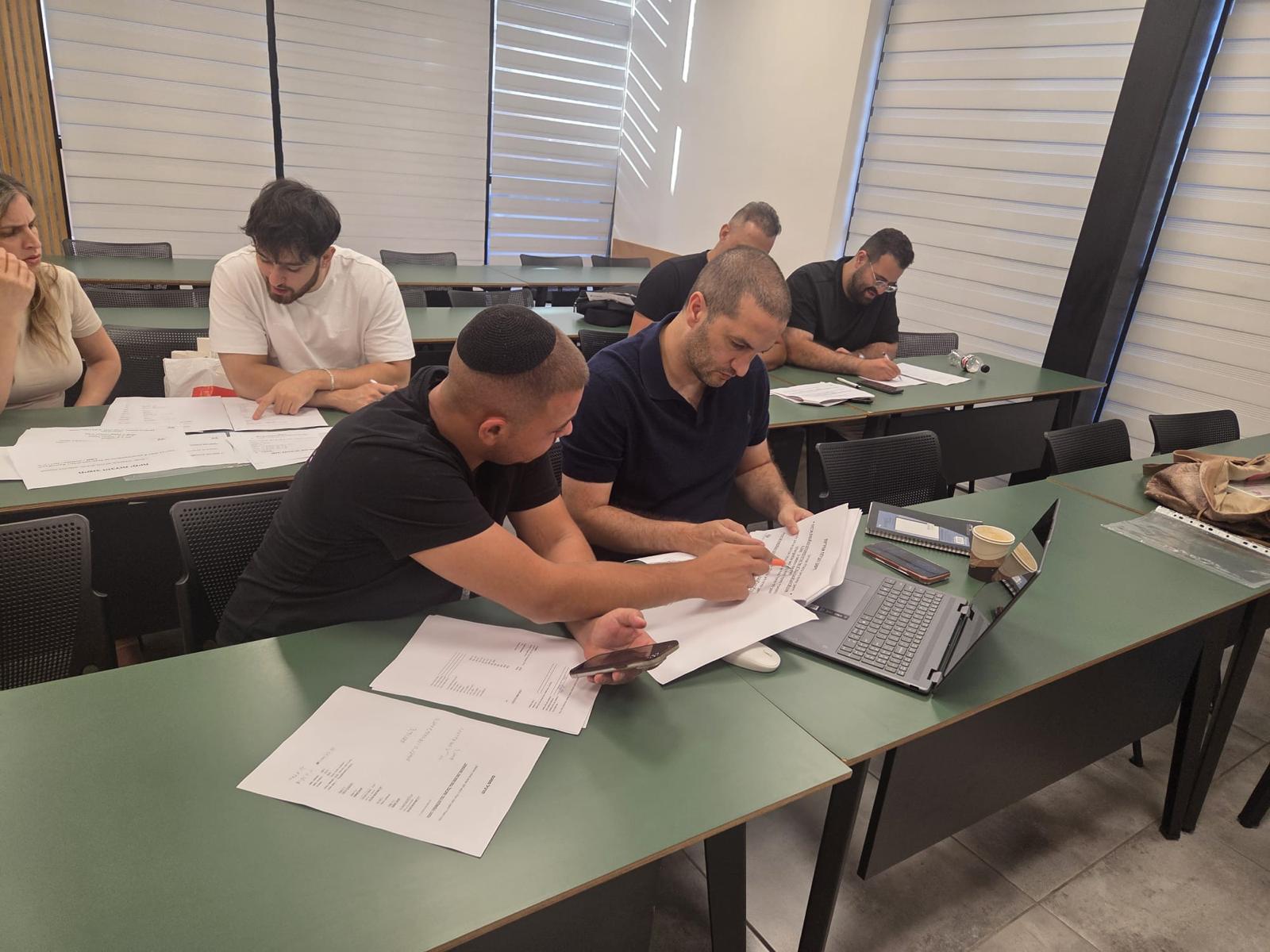 Business people analyzing import costs and calculations together