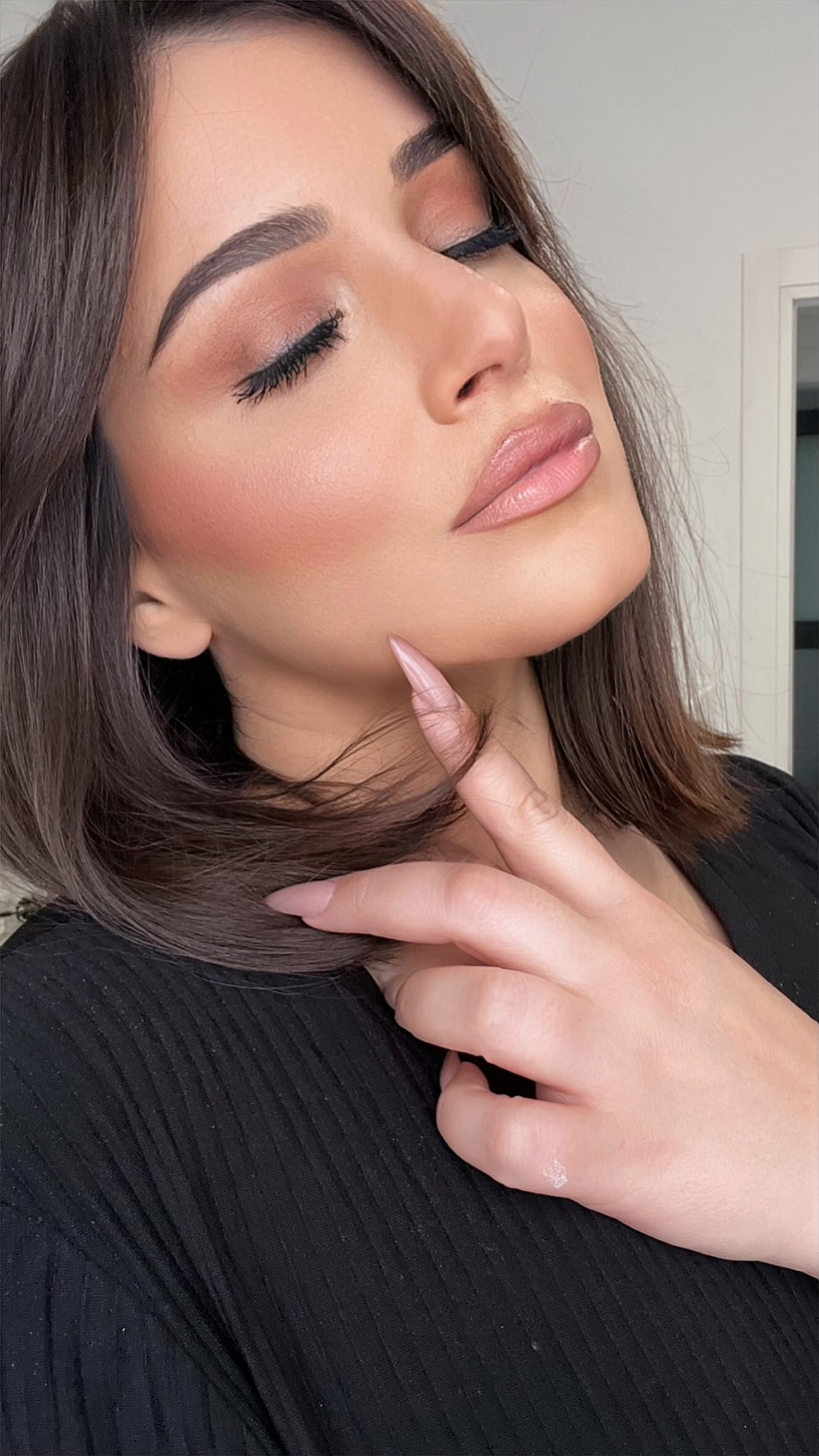 Professional Makeup Artist, applying makeup to bride model